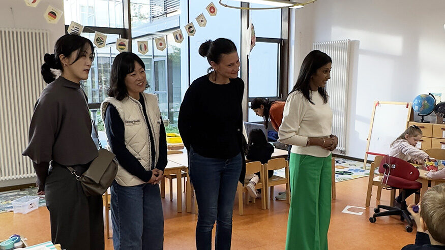 A group of parents in a classroom